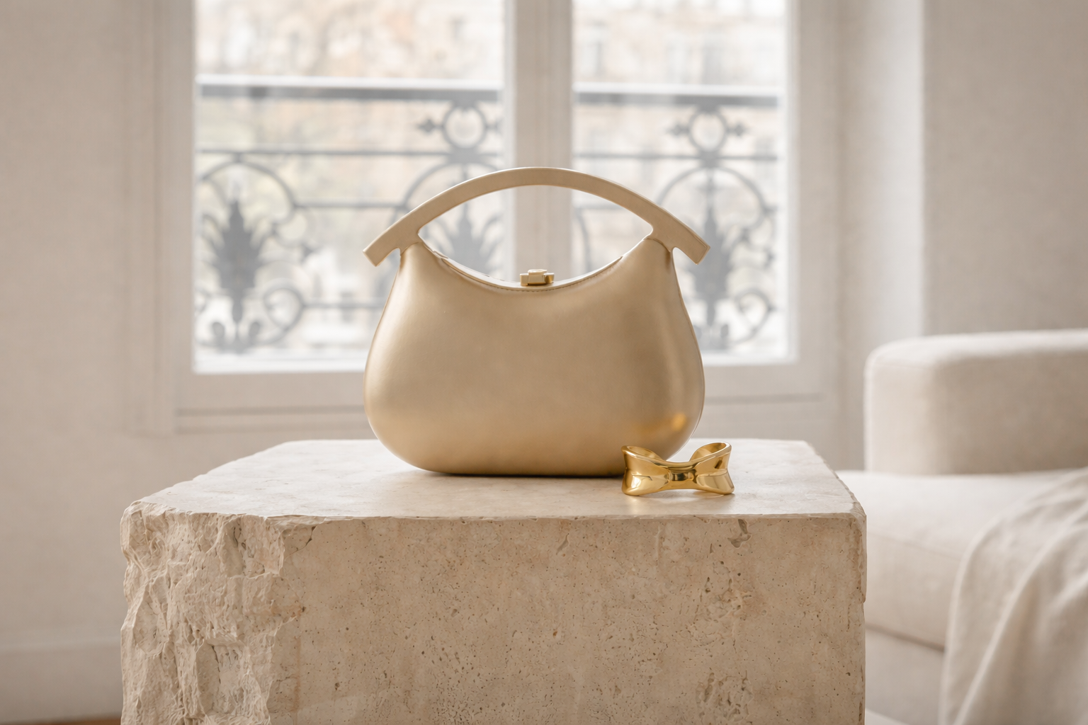 Elegant luxury bag in gold on marble pedestal